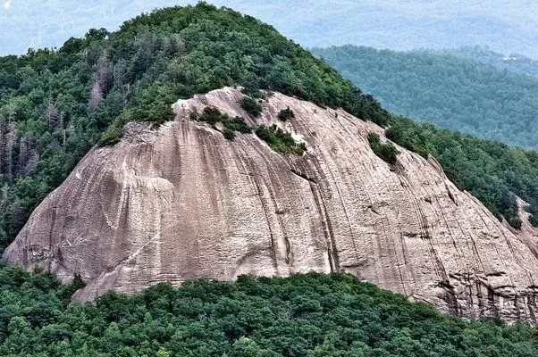 Looking Glass Rock, the massive granite dome rising out of the Pisgah forest, the same ancient granite that polished the face of Sliding Rock